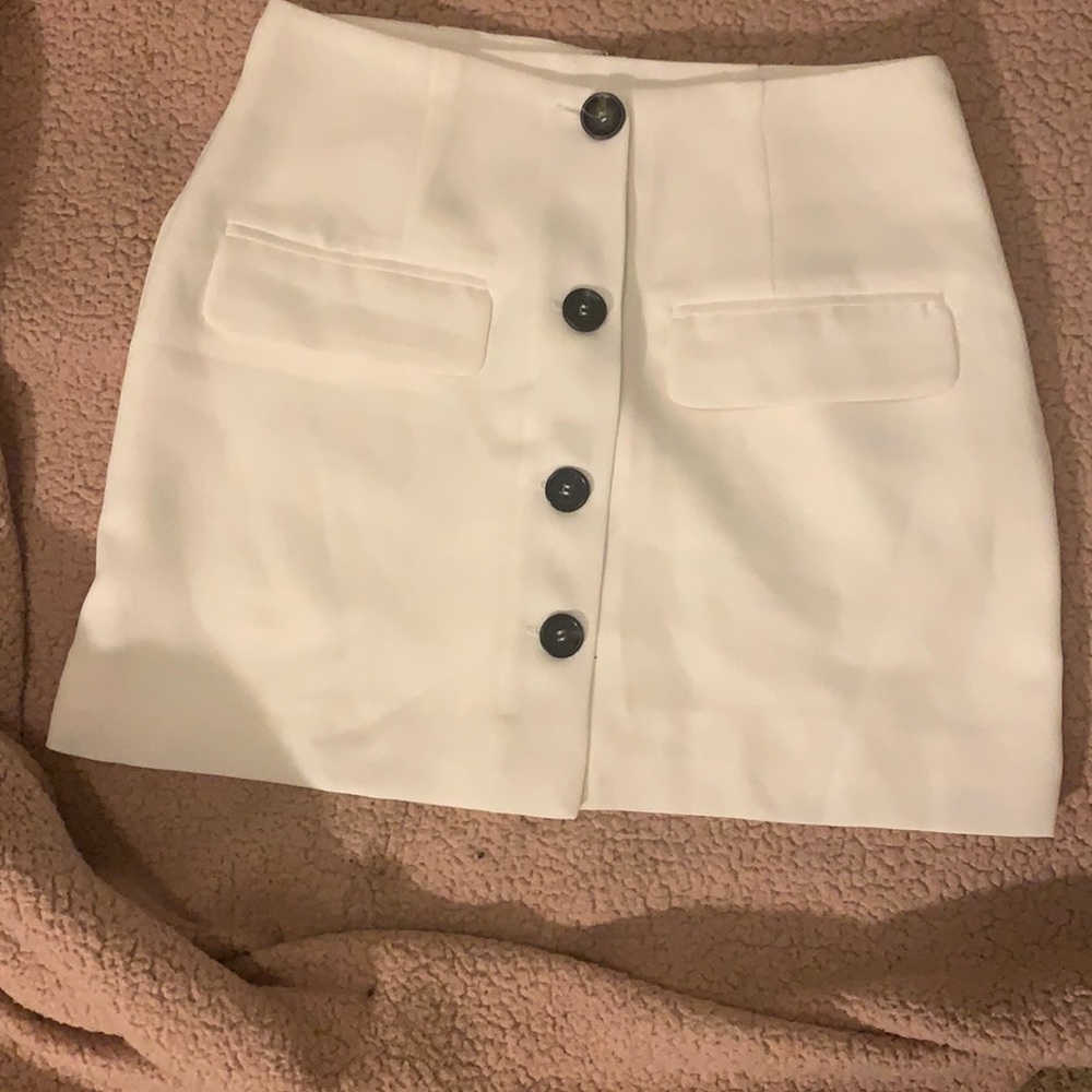 A beautiful off white/cream skirt. Never worn.